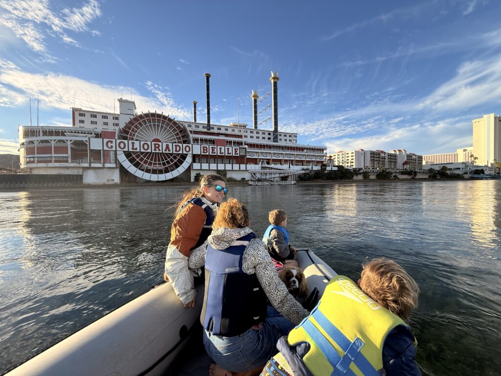 Family boating on the Colorado River near the Colorado Belle in Laughlin