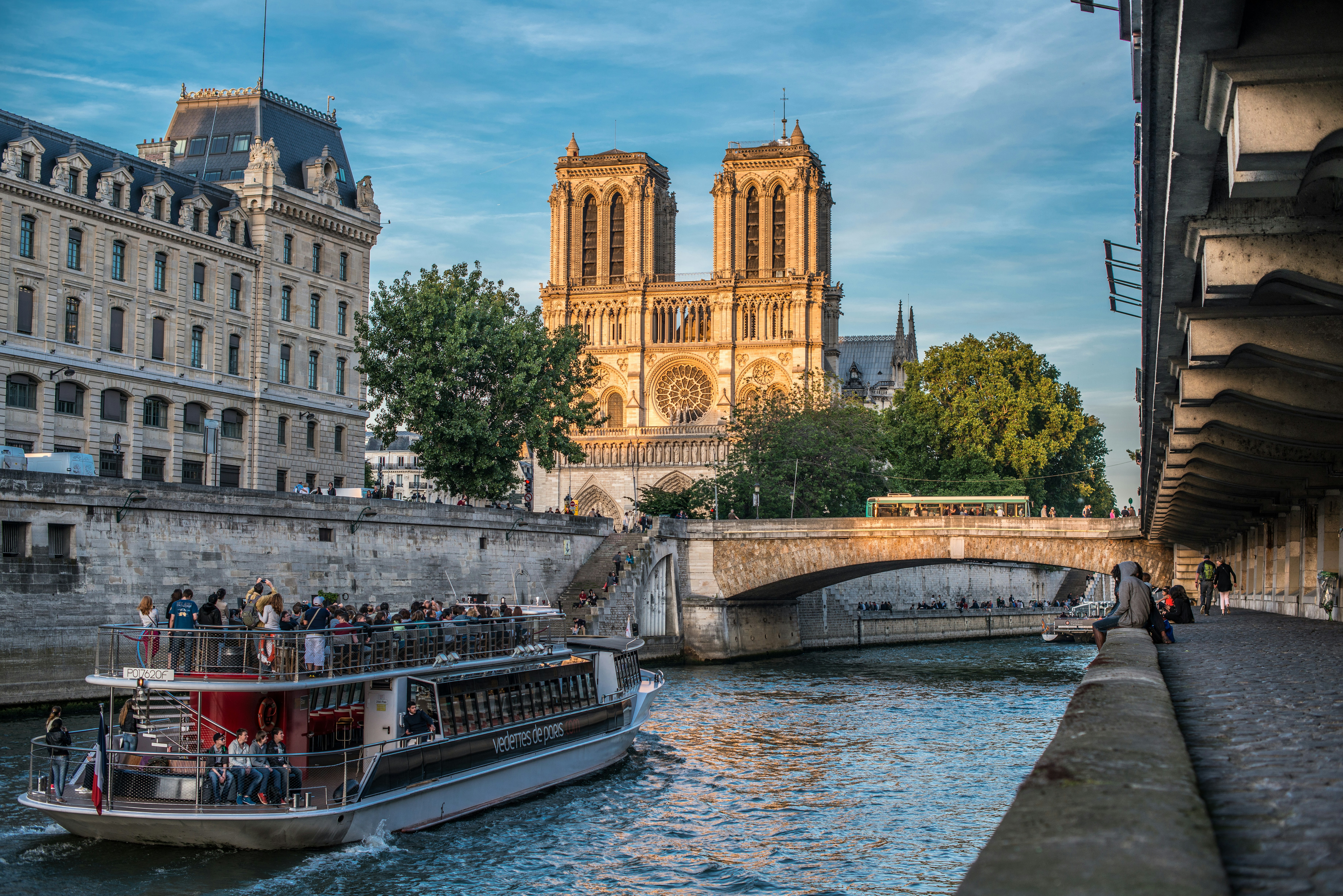 a boat on a river with buildings on either side of it