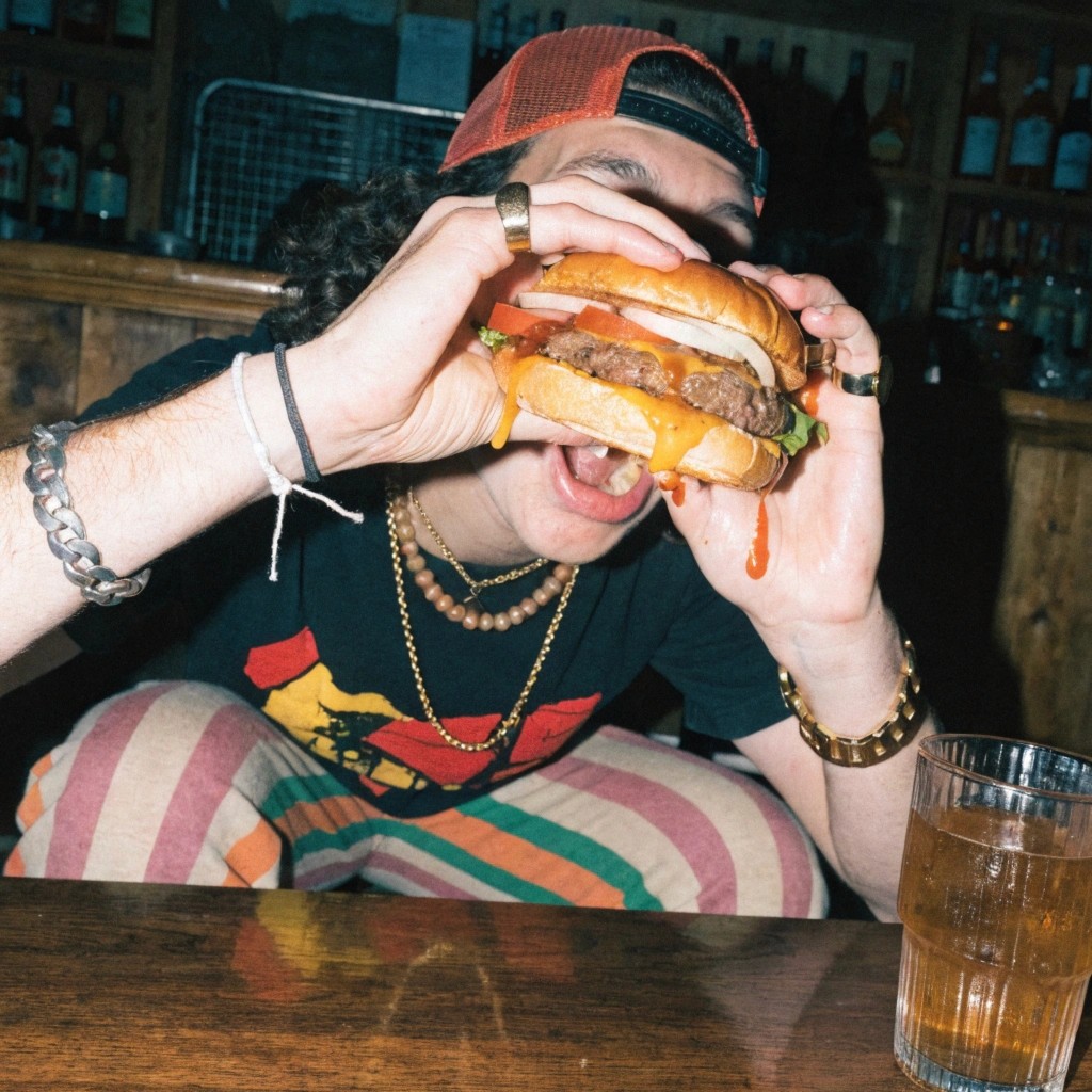 man eating burger