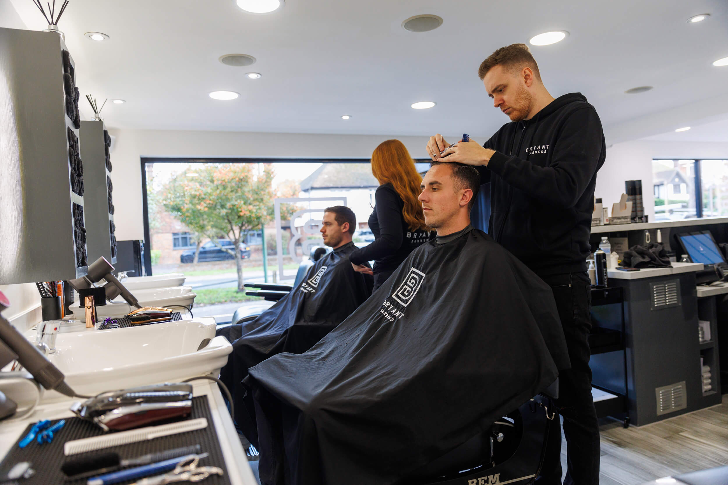 Bryant Barbers team cutting hair