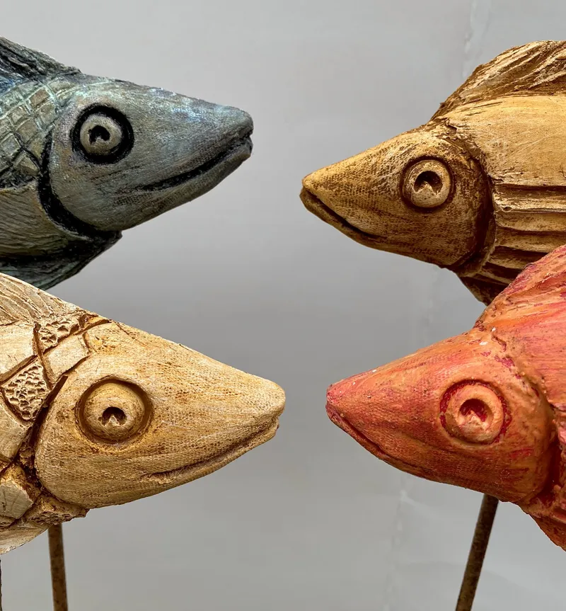 close up of fish sculpture faces