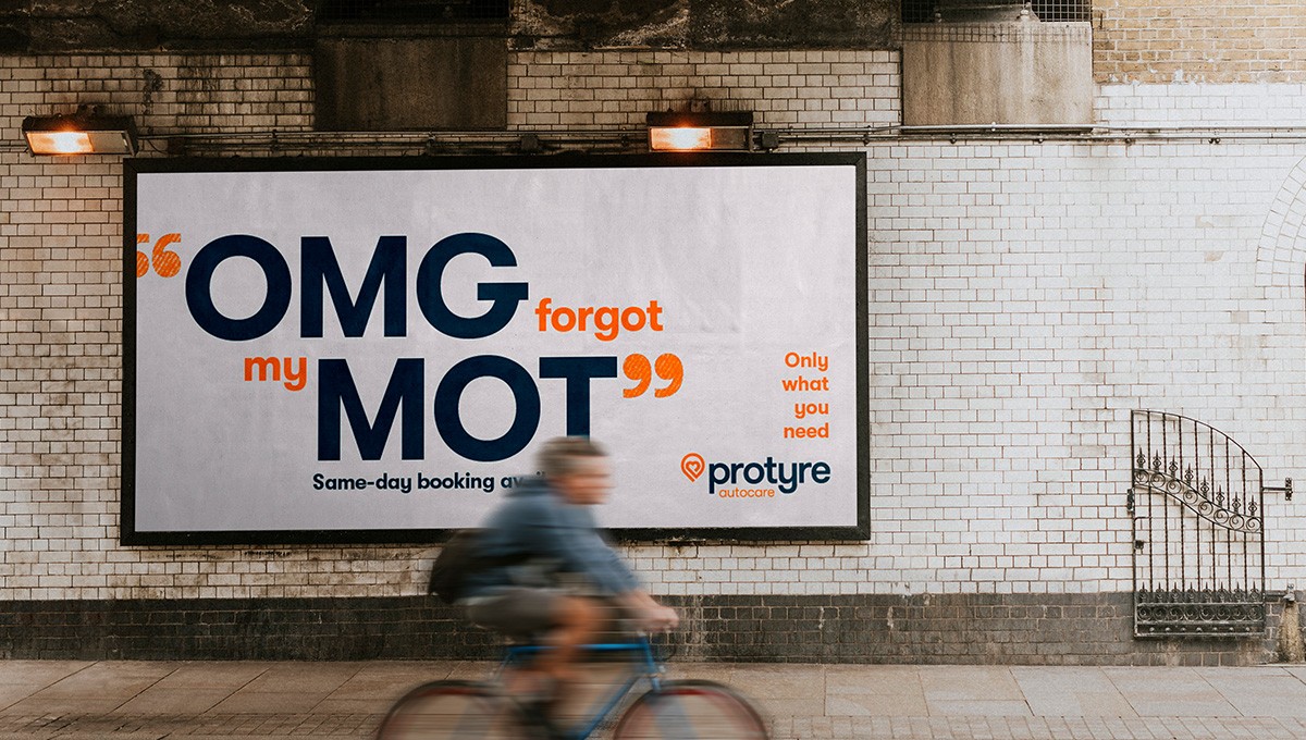 Billboard in a street in London, copy says 'OMG forgot my MOT''