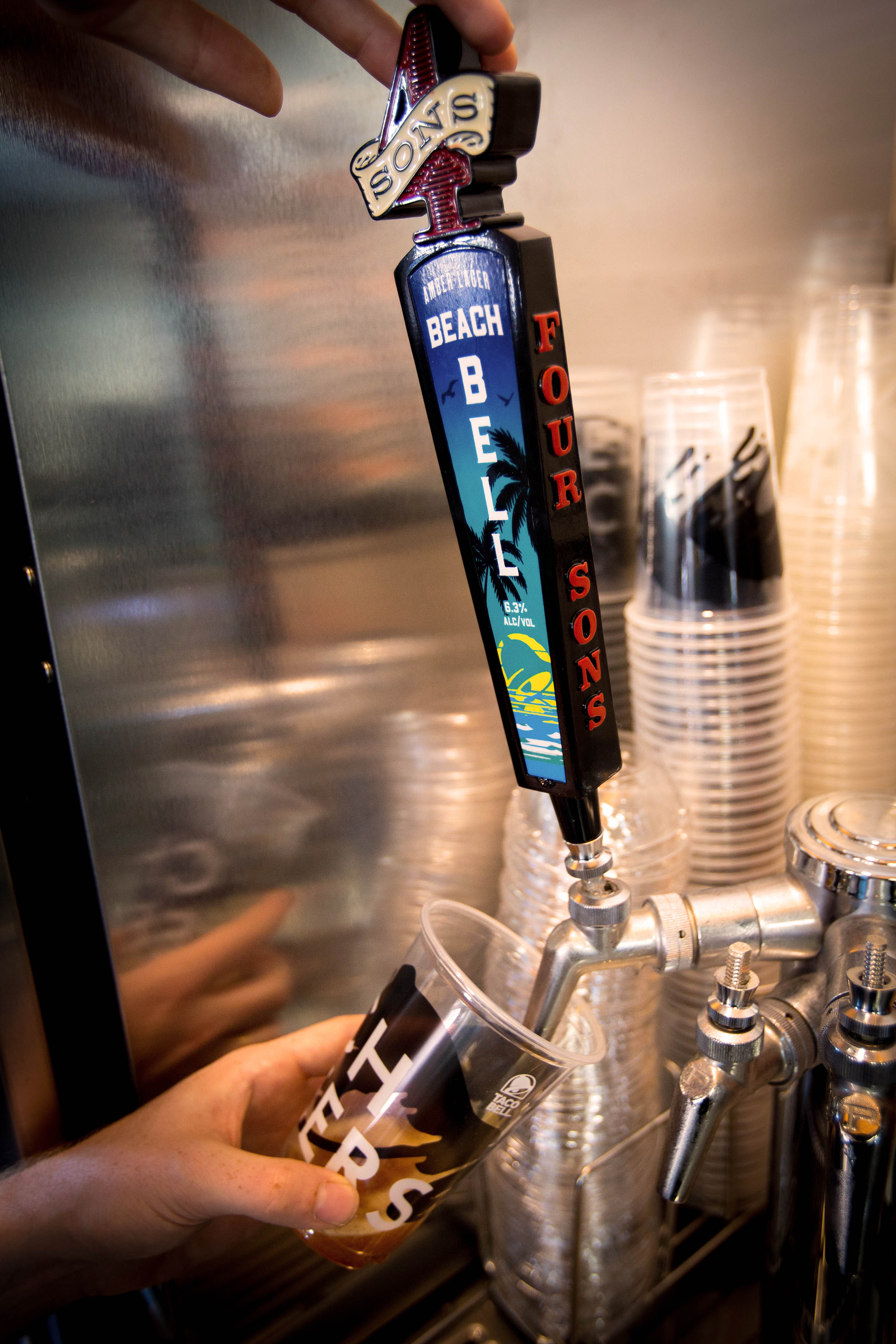 Draft beer tap handle close-up in bar setting