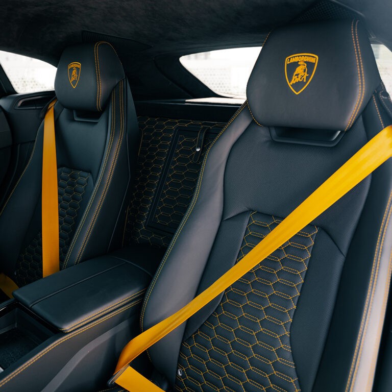 Lamborghini Urus S interior with yellow accents, premium leather seats, luxury SUV interior.