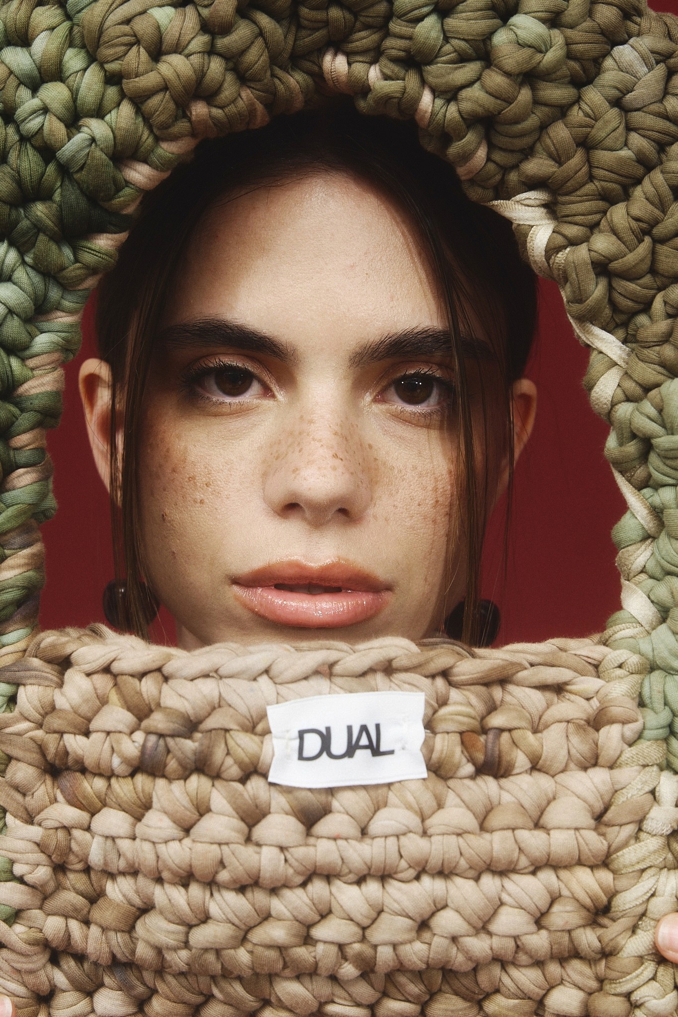 Two girls sitting on the ground with skateboards