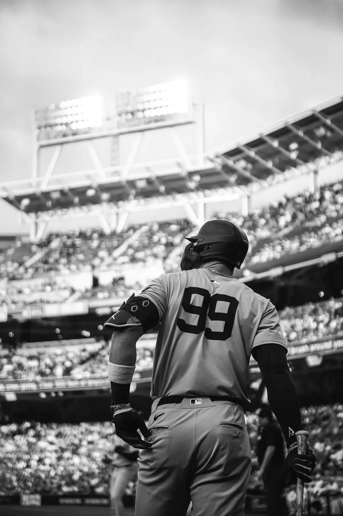 Man tending plants inside a greenhouse
