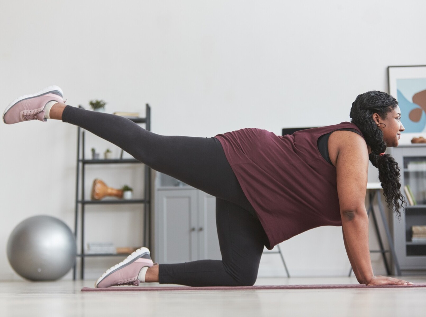 overweight woman doing exercises for weight loss at home to help with her PCOS