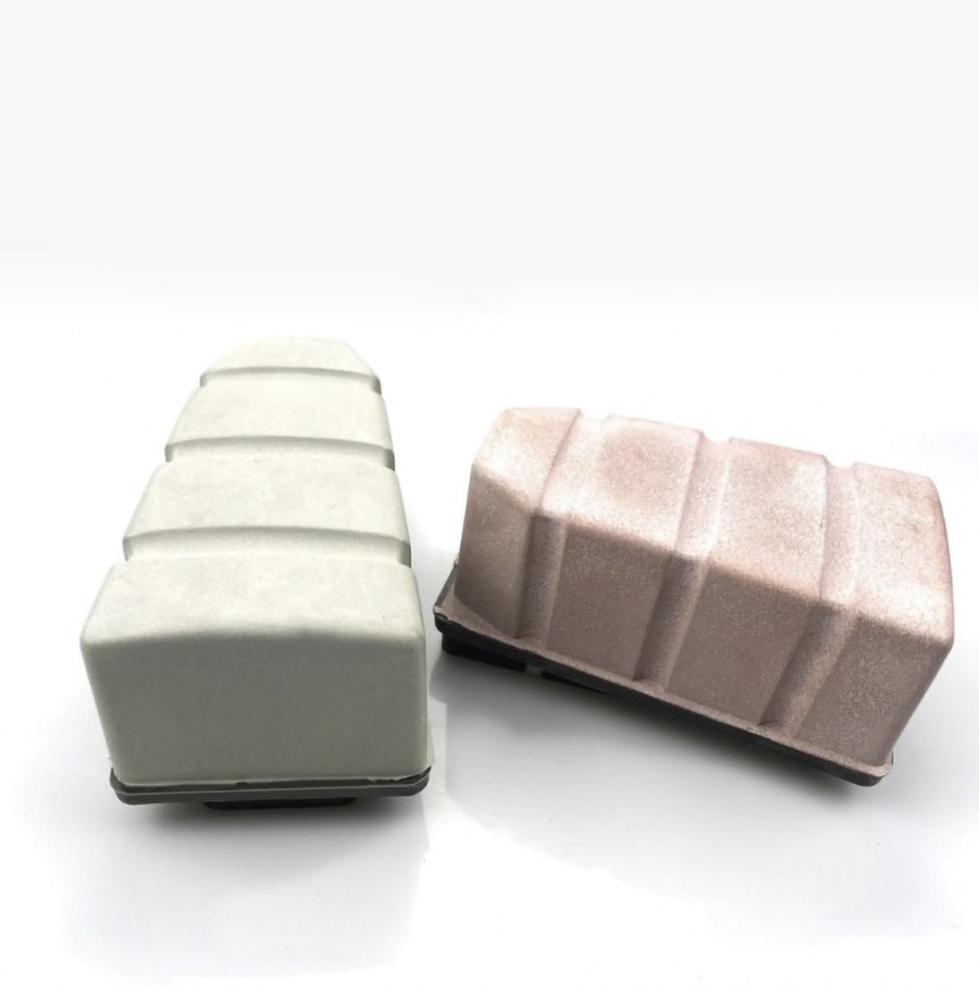 Two resin bond diamond fickerts, one white and one pink, positioned side by side, showcasing their design and structure.