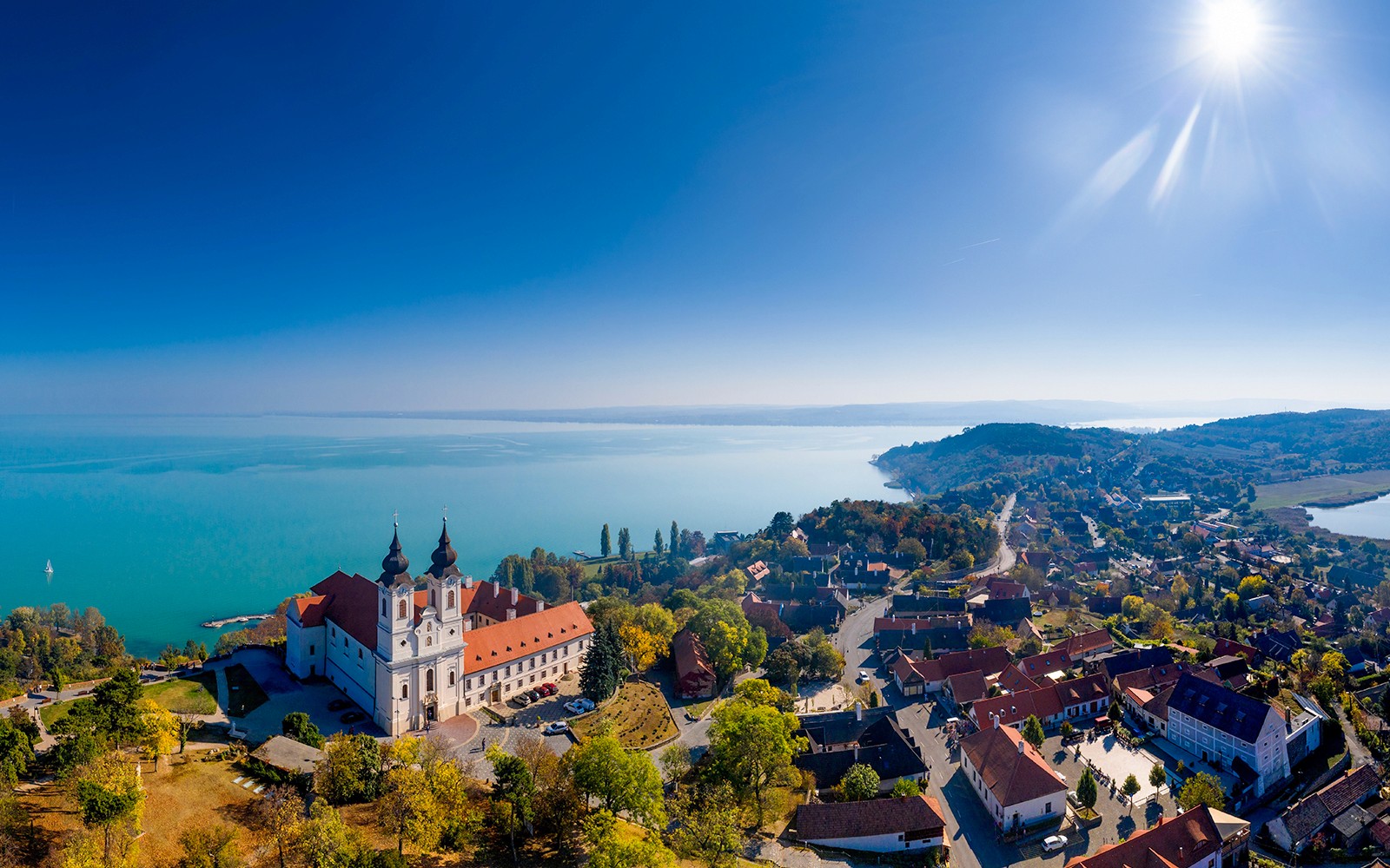 Tihany Abbey overlooking Lake Balaton, Hungary, with surrounding village and landscape.