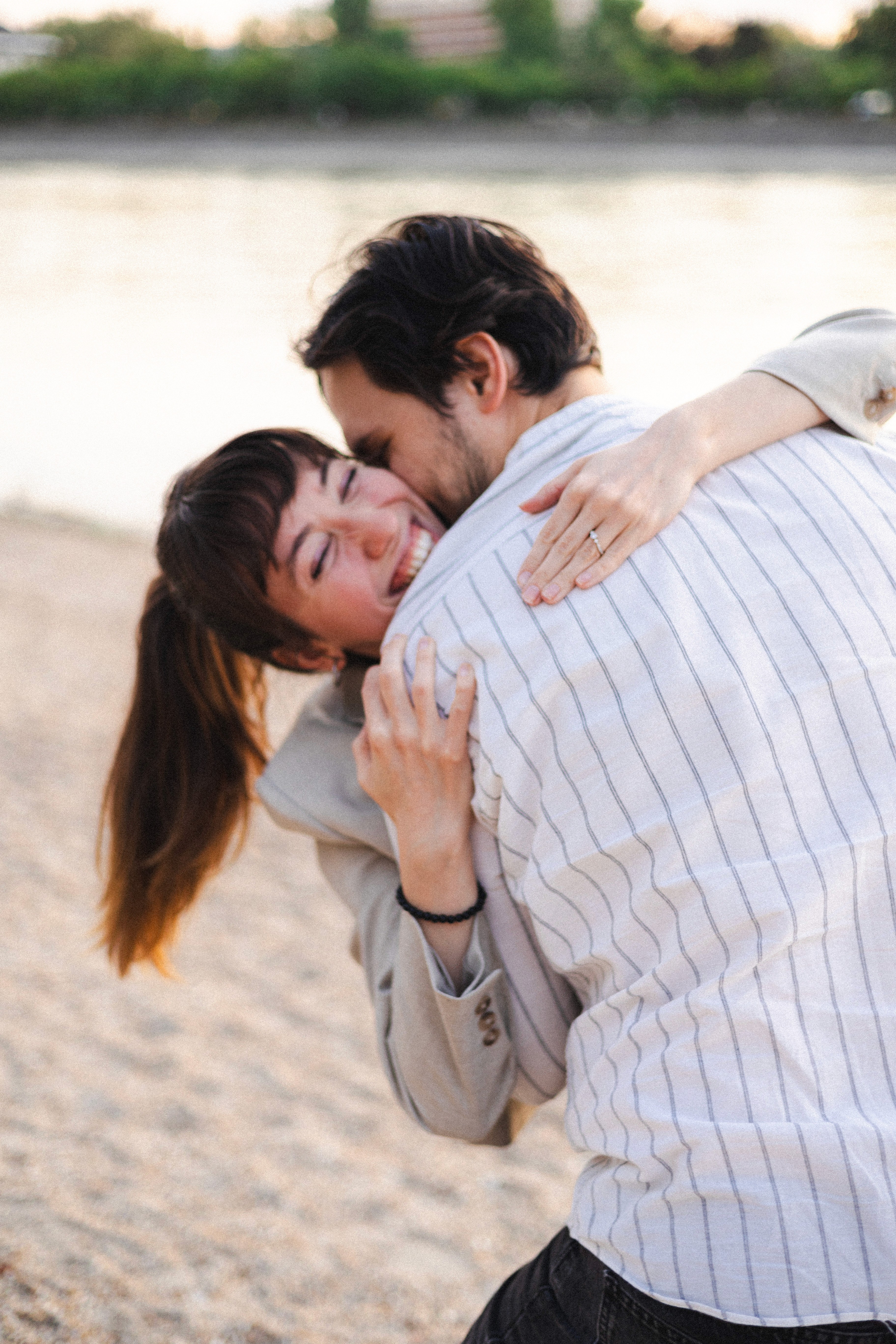 Woman preparing a healthy meal with fresh ingredients and herbal tea in a cozy kitchen filled with natural light.
