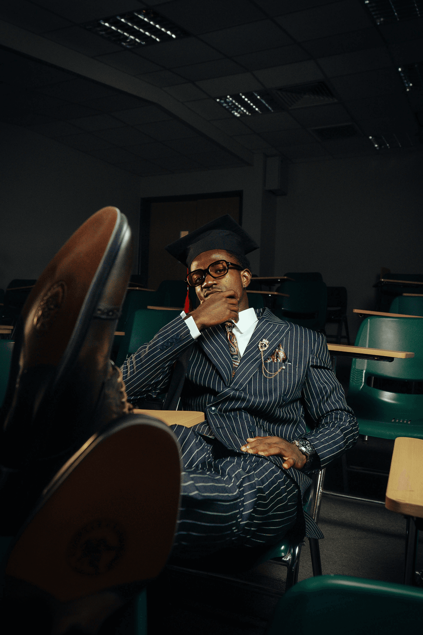 Man in suit in classroom.