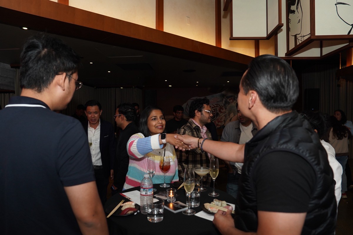 AI Circle members connecting over drinks