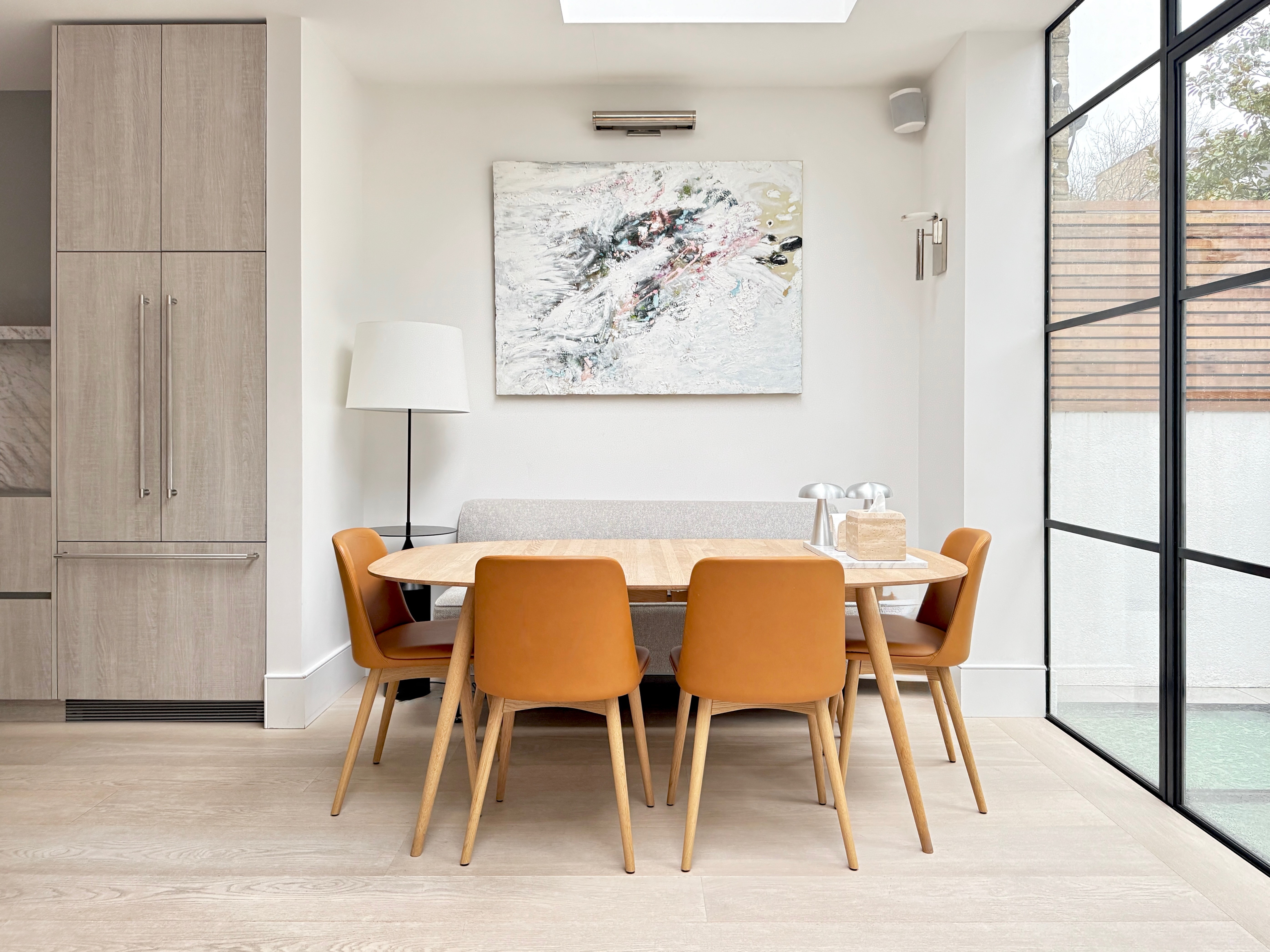 white sofa chair near fireplace