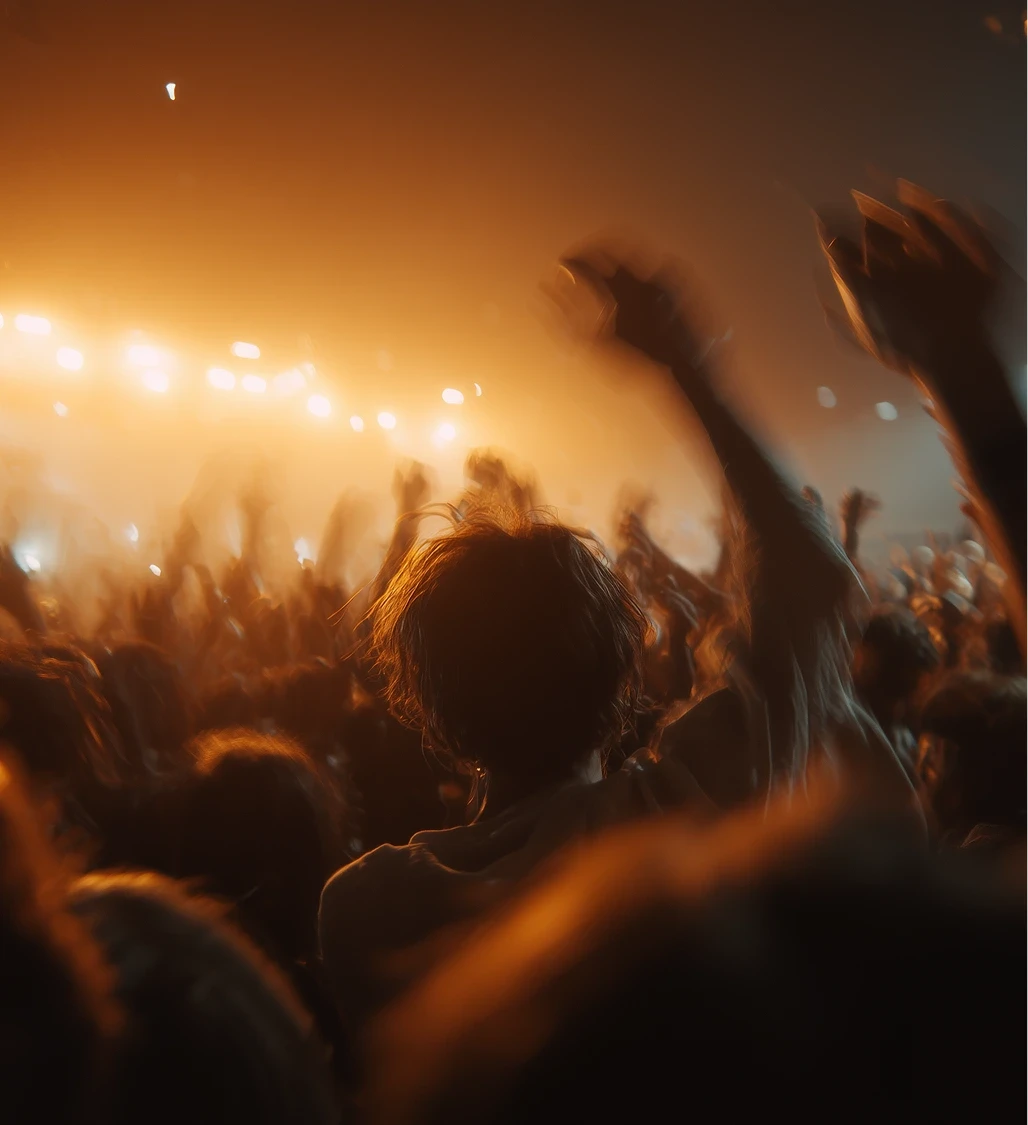 Vocalist singing under bright, hazy orange light