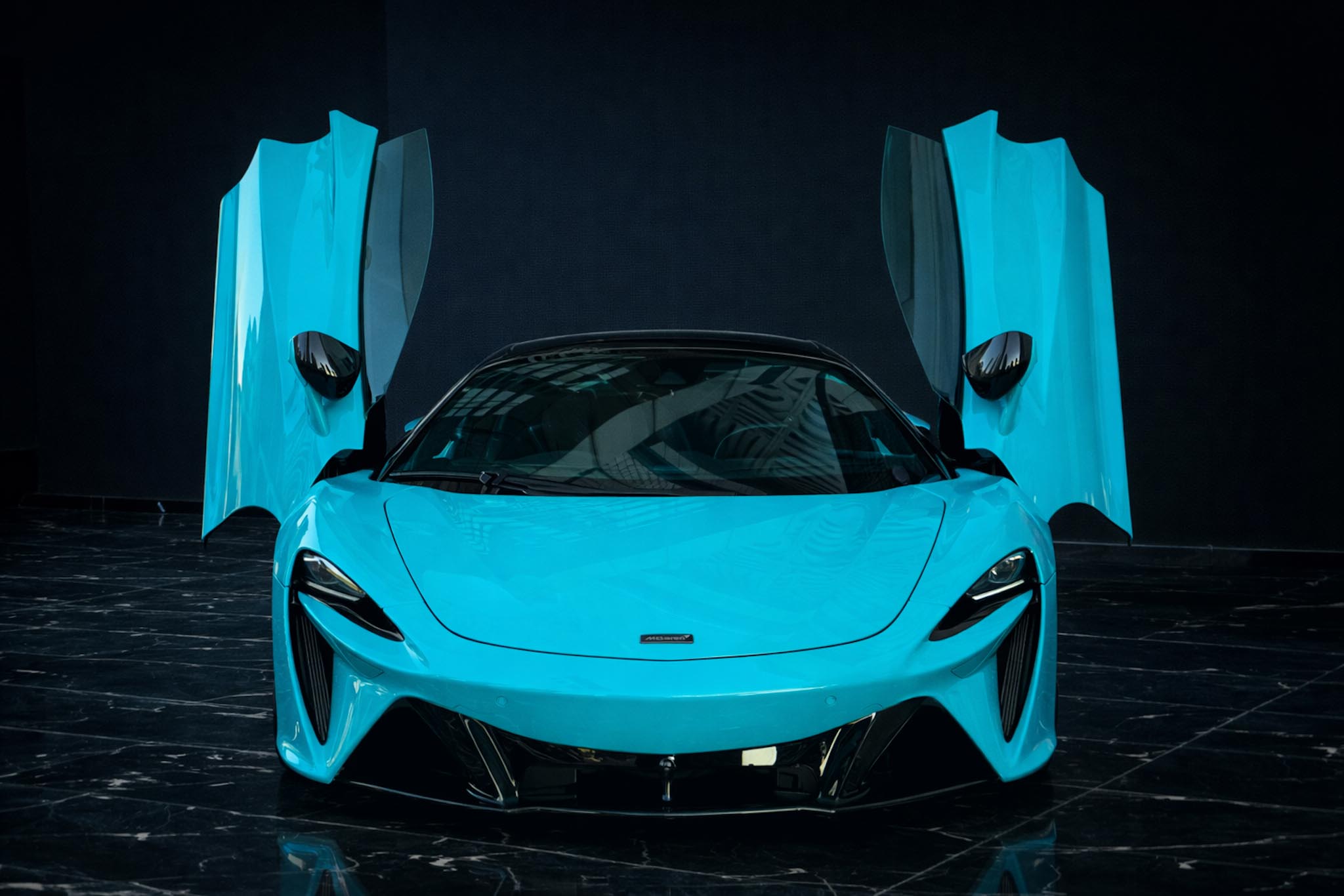 McLaren Artura Spider 2025 Cerulean Blue fron side exterior by Queen of Supercar Rental Dubai