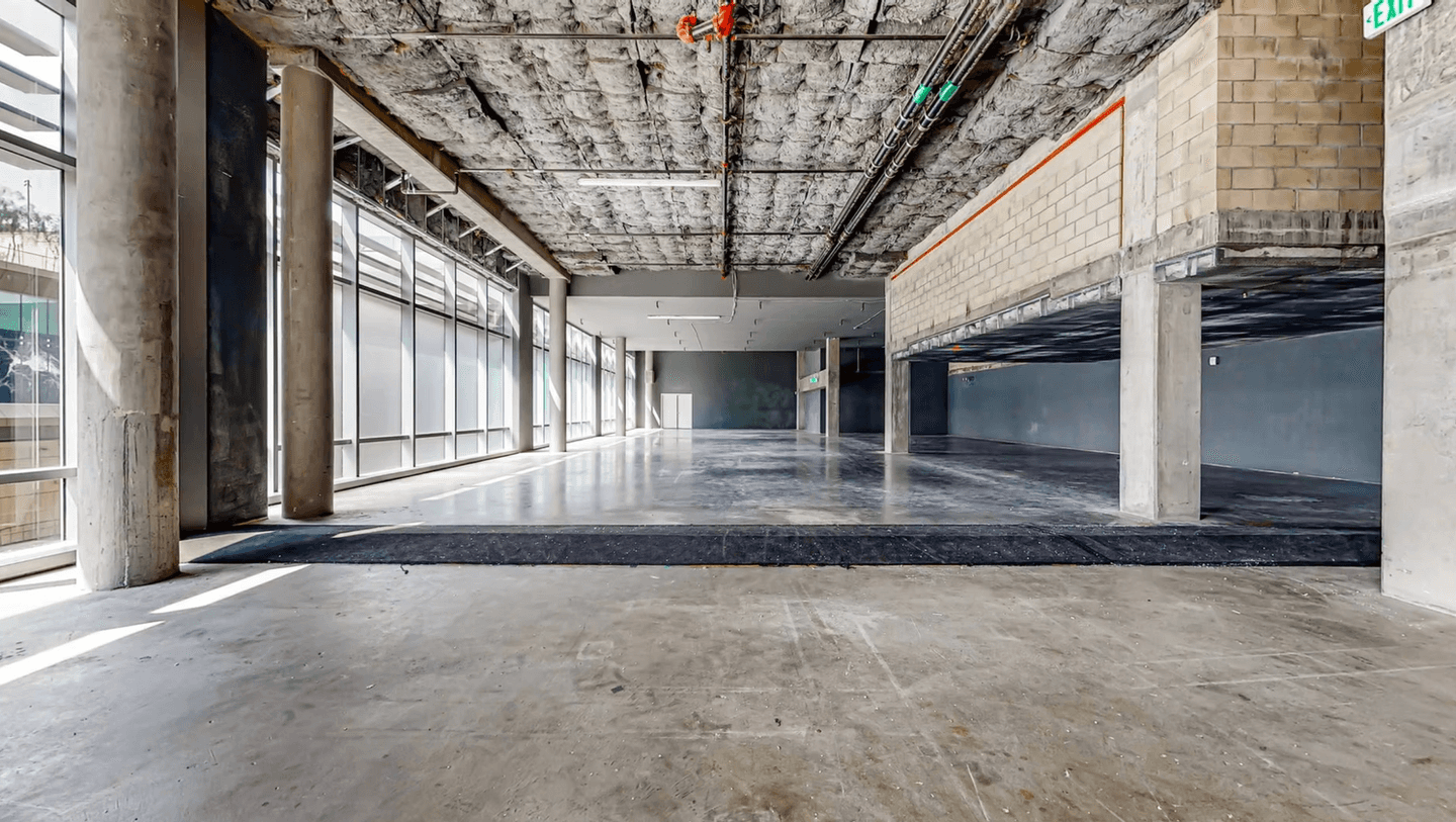 Open tenant-improvement interior at Metropolis with exposed ceiling services