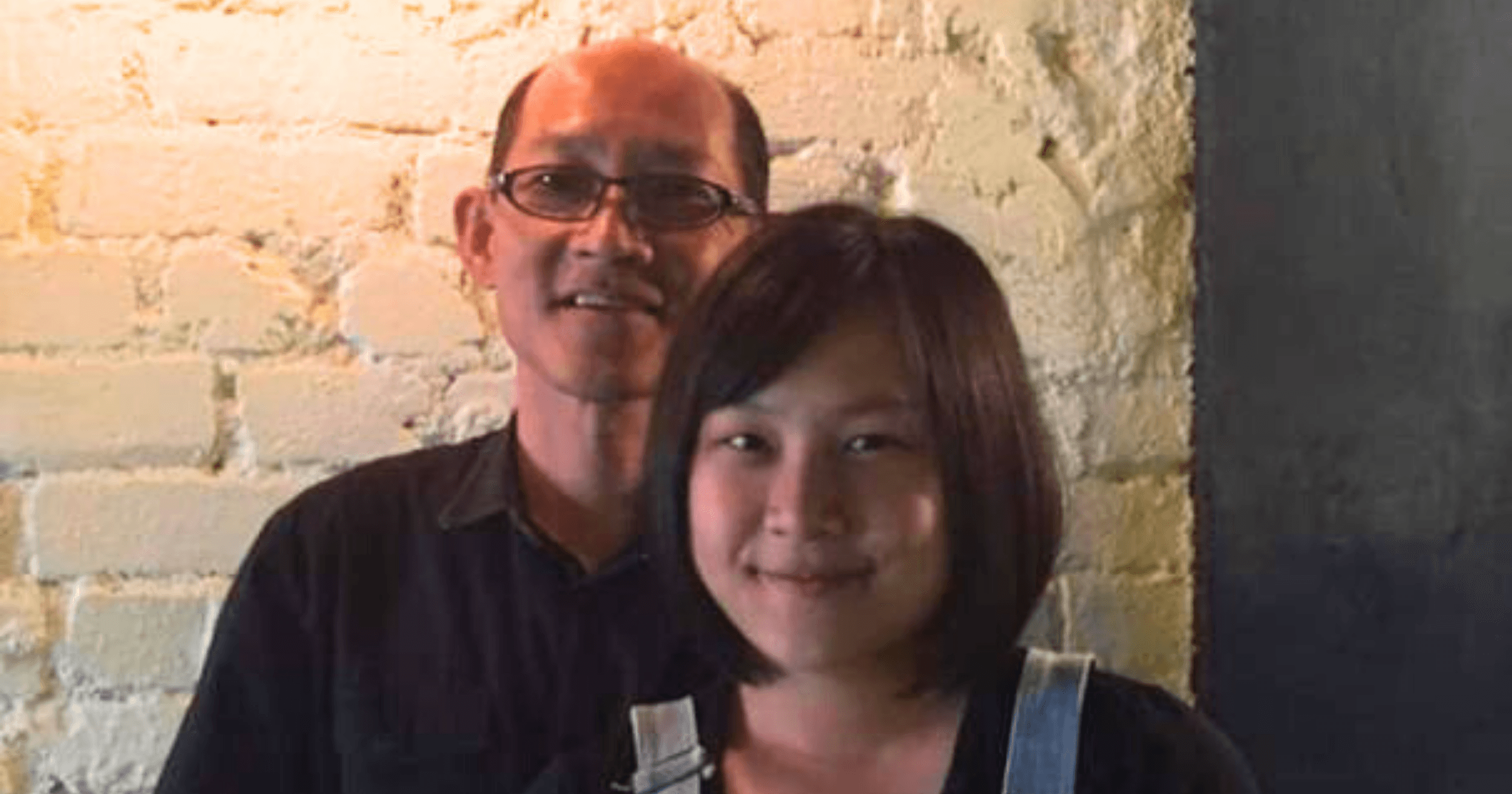 Sukee and her father inside their family business restaurant.