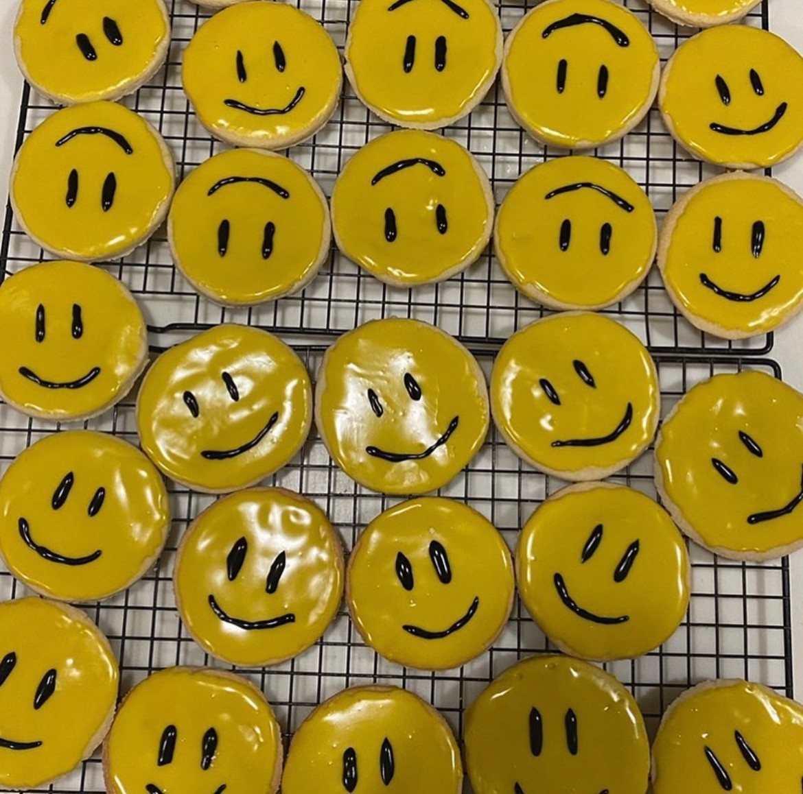 Yellow smiley face decorated sugar cookies