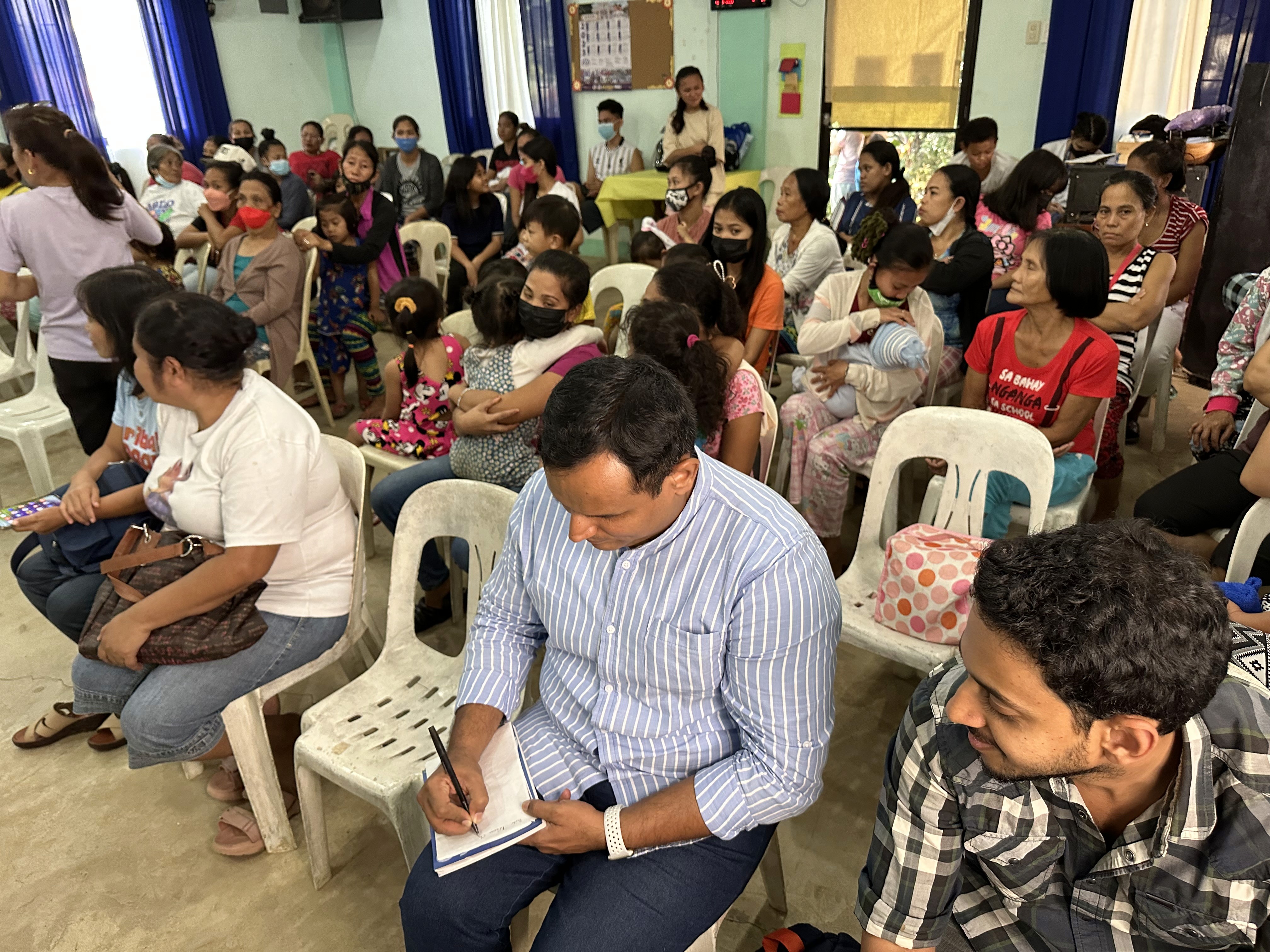 the interior of a church with pews and a gold alter