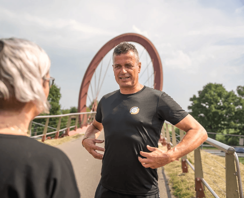 Snowboarder enjoys a downhill run on a sunny day.