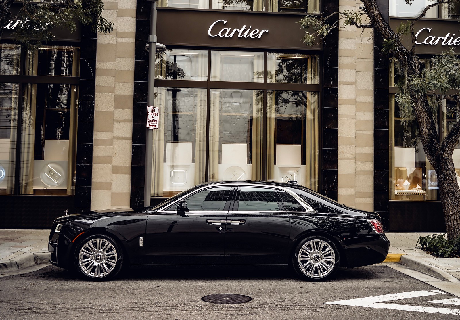 Perfect side profile highlighting the Ghost's elegant lines and black exterior from the driver side.