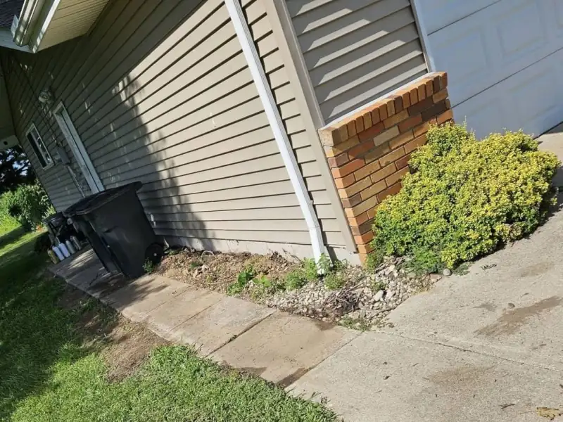 After: walkway cleared beside house