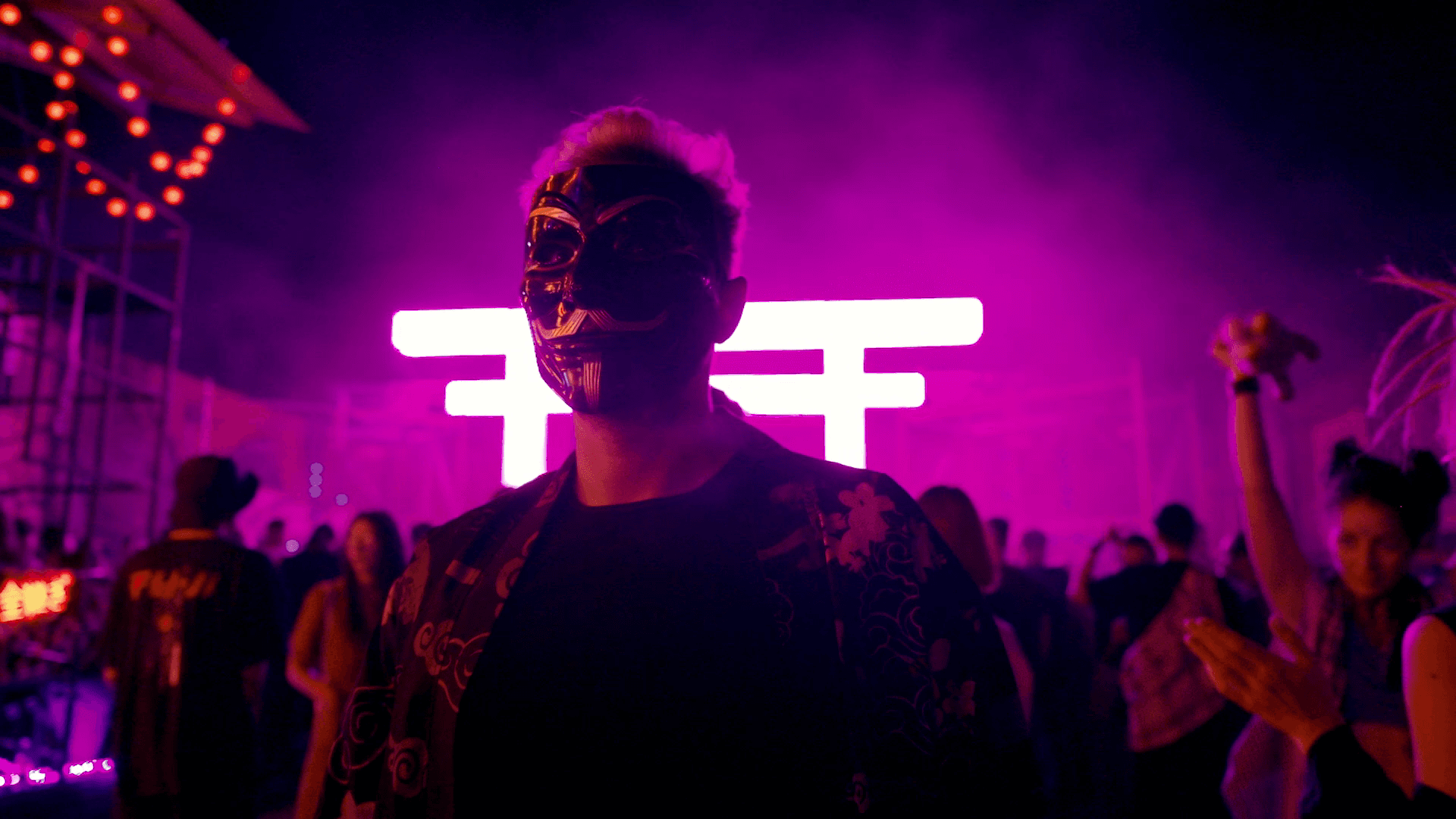 A masked man at a festival