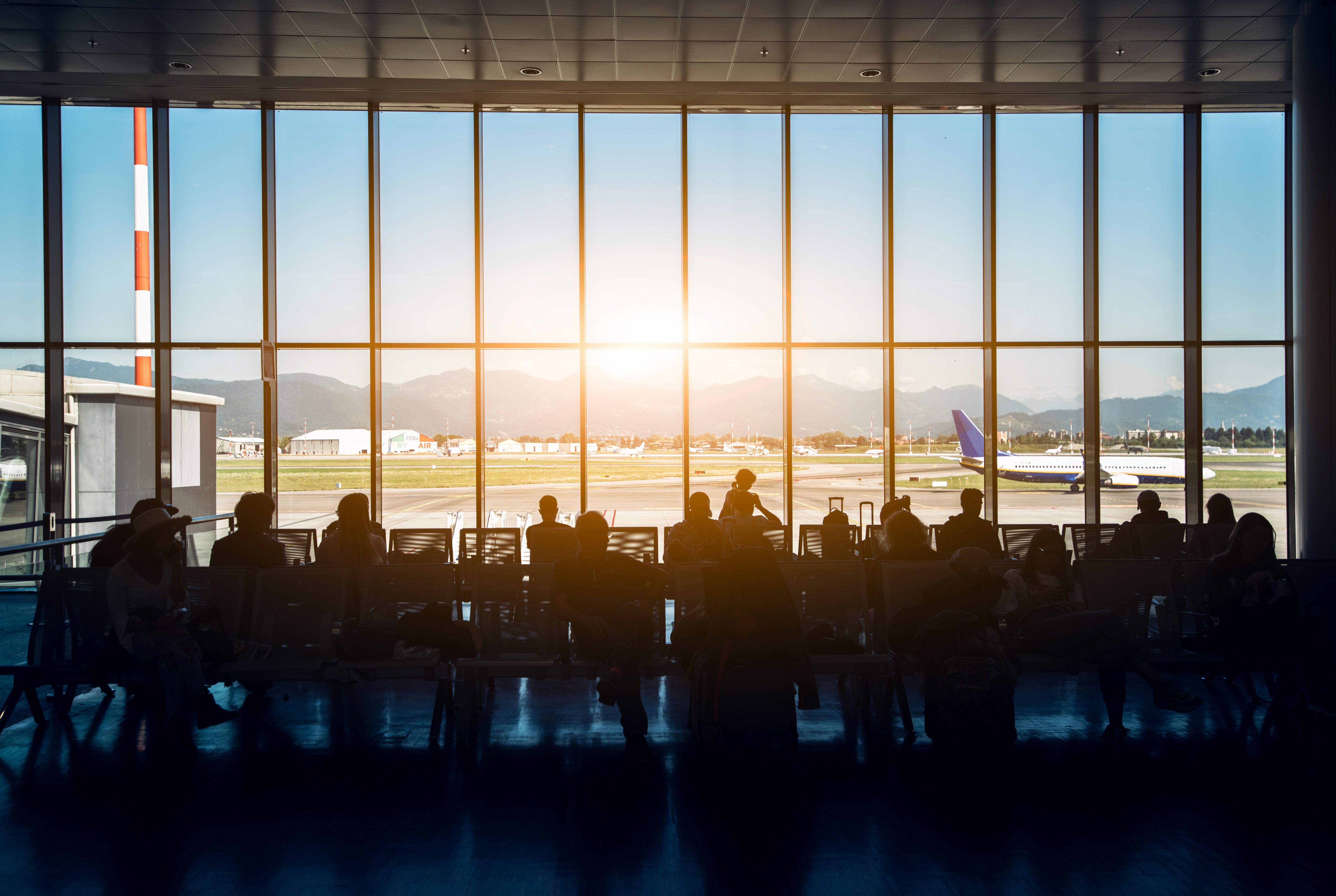 man wearing gray polo shirt beside dry-erase board