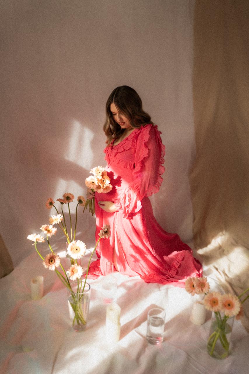 Fashion photoshoot with a woman posing in a dress