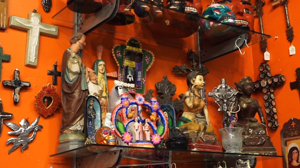 crosses and icon ona shelf with orange backdrop