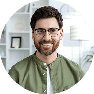 a man standing in front of a bookshelf