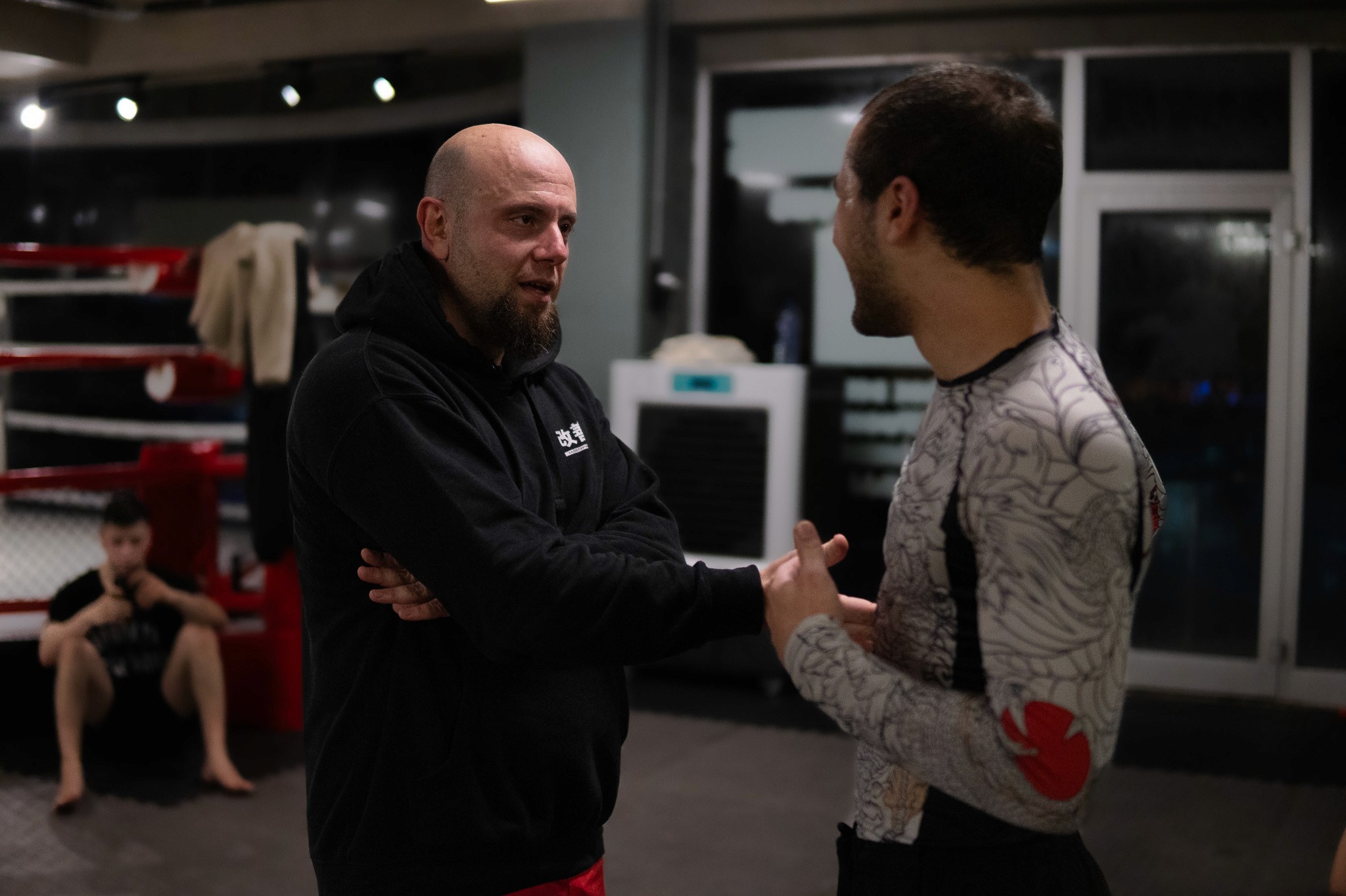 a photo of coach Faruk talking to a student