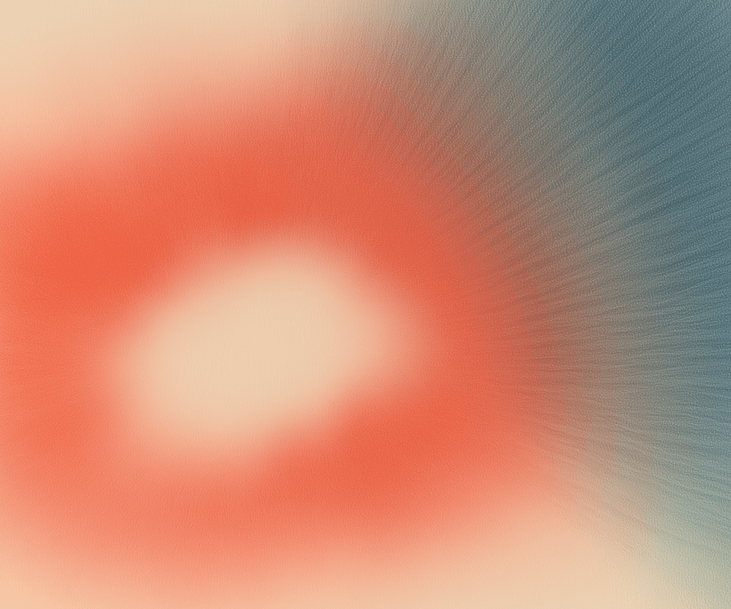 Abstract swirl of red and blue hues in a blurry image, conveying a sense of motion and fluidity.