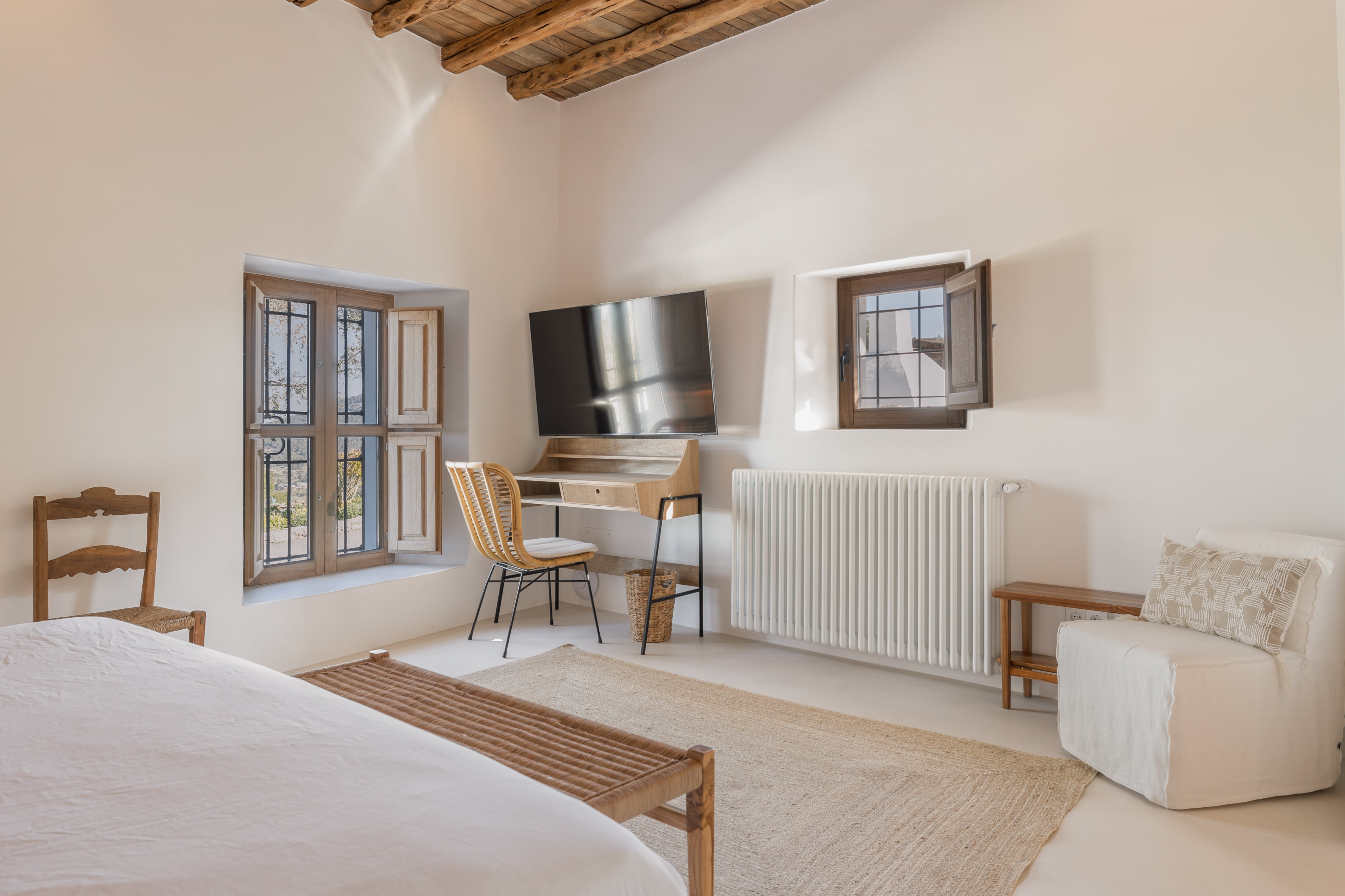 Master Bedroom with desk, Smart TV and Rustic Windows