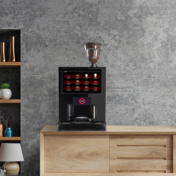 Black coffee machine on wooden cabinet in modern office setting