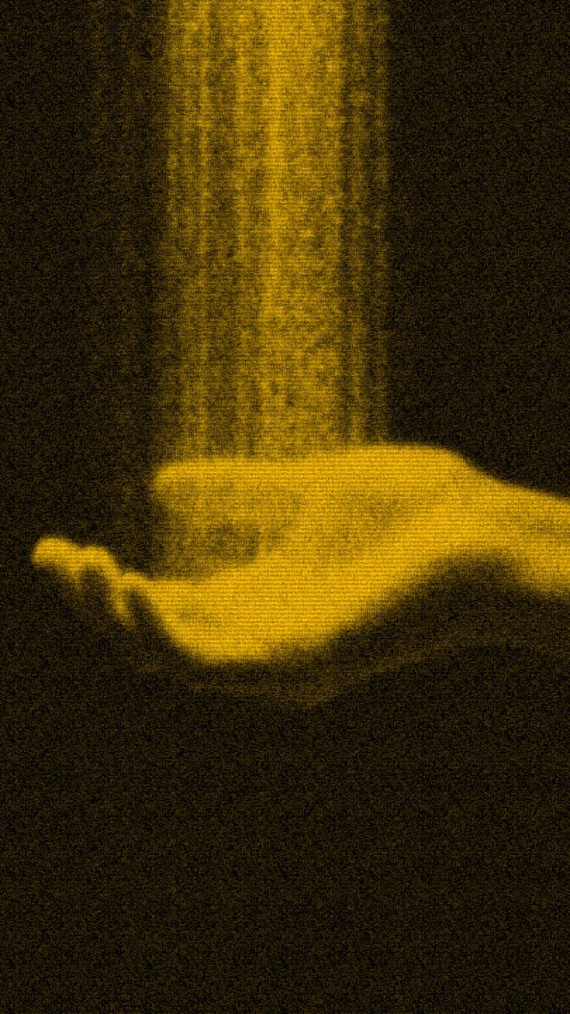 golden light pouring into an open palm from above