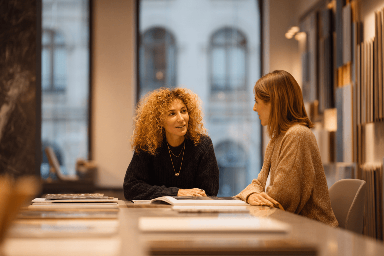a man standing in front of a display of wooden doors