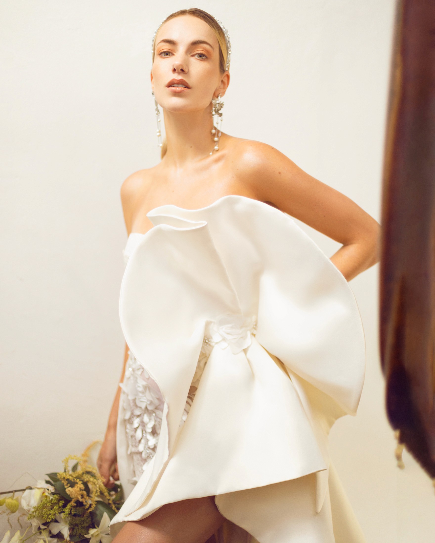 Creative portrait with geometric pink eyewear and bold fashion styling in urban setting