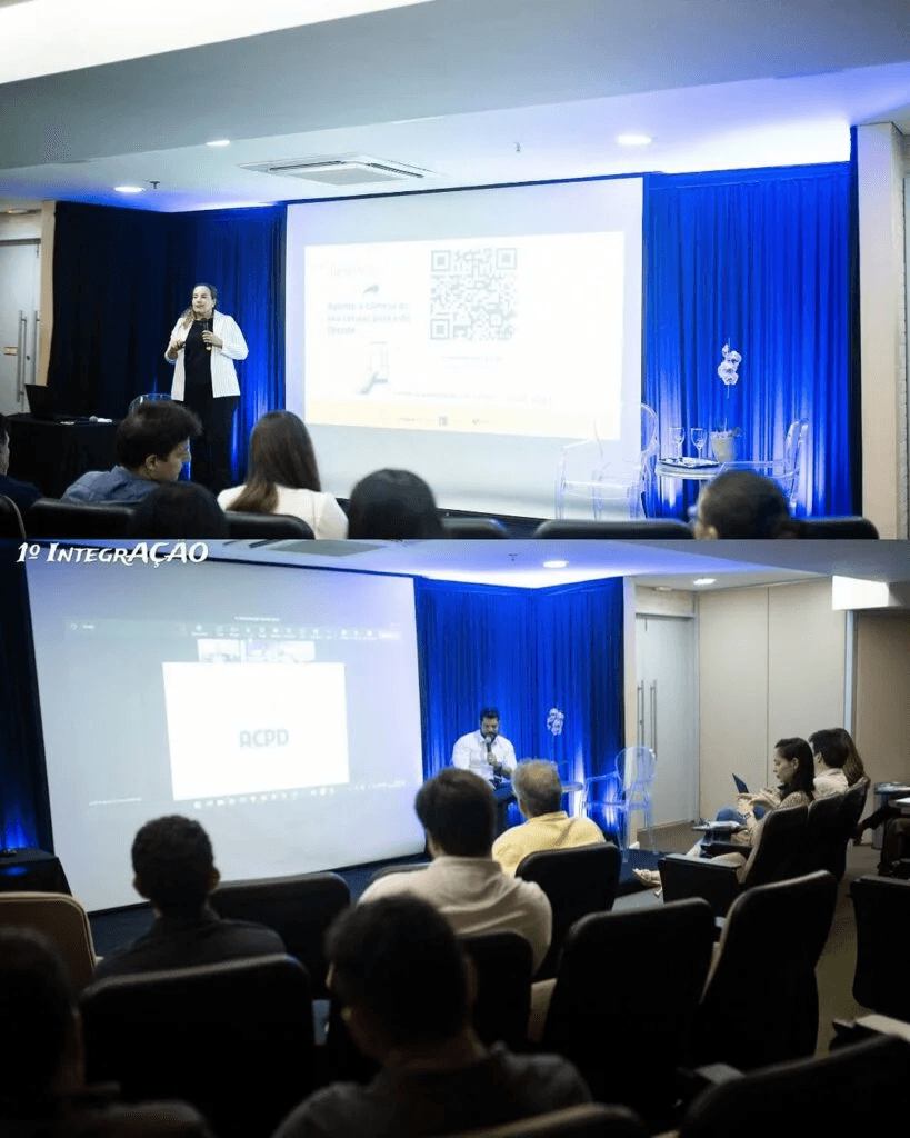 Close-up of lush, dark green leaves, some glossy and wet, against a muted background.