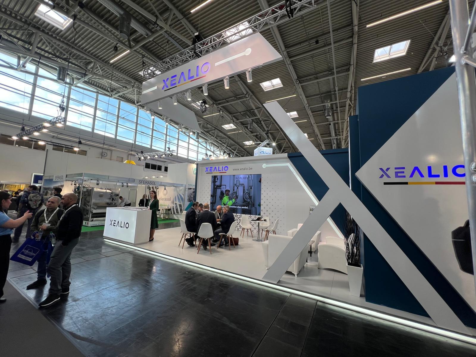 Blue and white colour palette detail at the Xealio stand, creating a clean, modern, and technological appearance consistent with the company's visual identity.