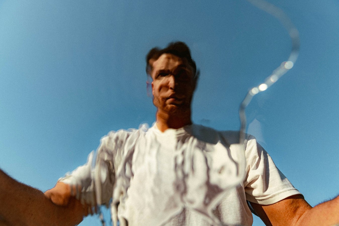 front view of ripple image of mans face underwater