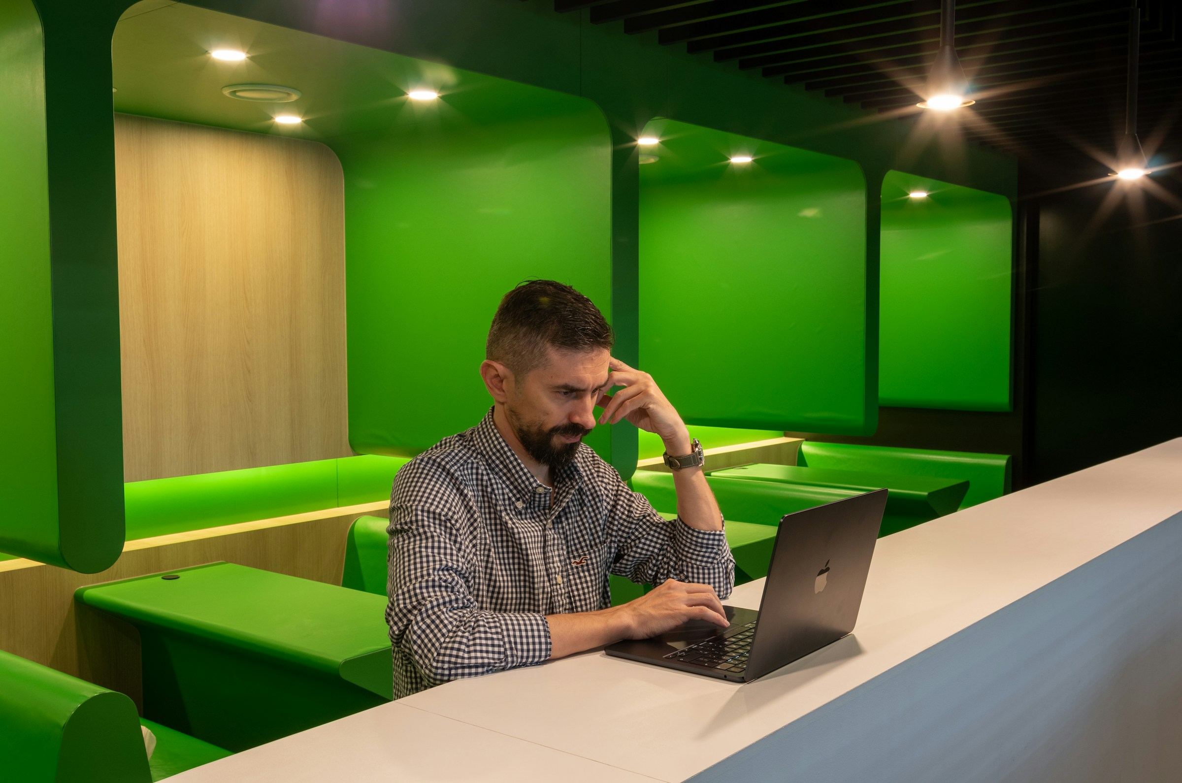 Man Using Laptop - How to Build A Conversational AI