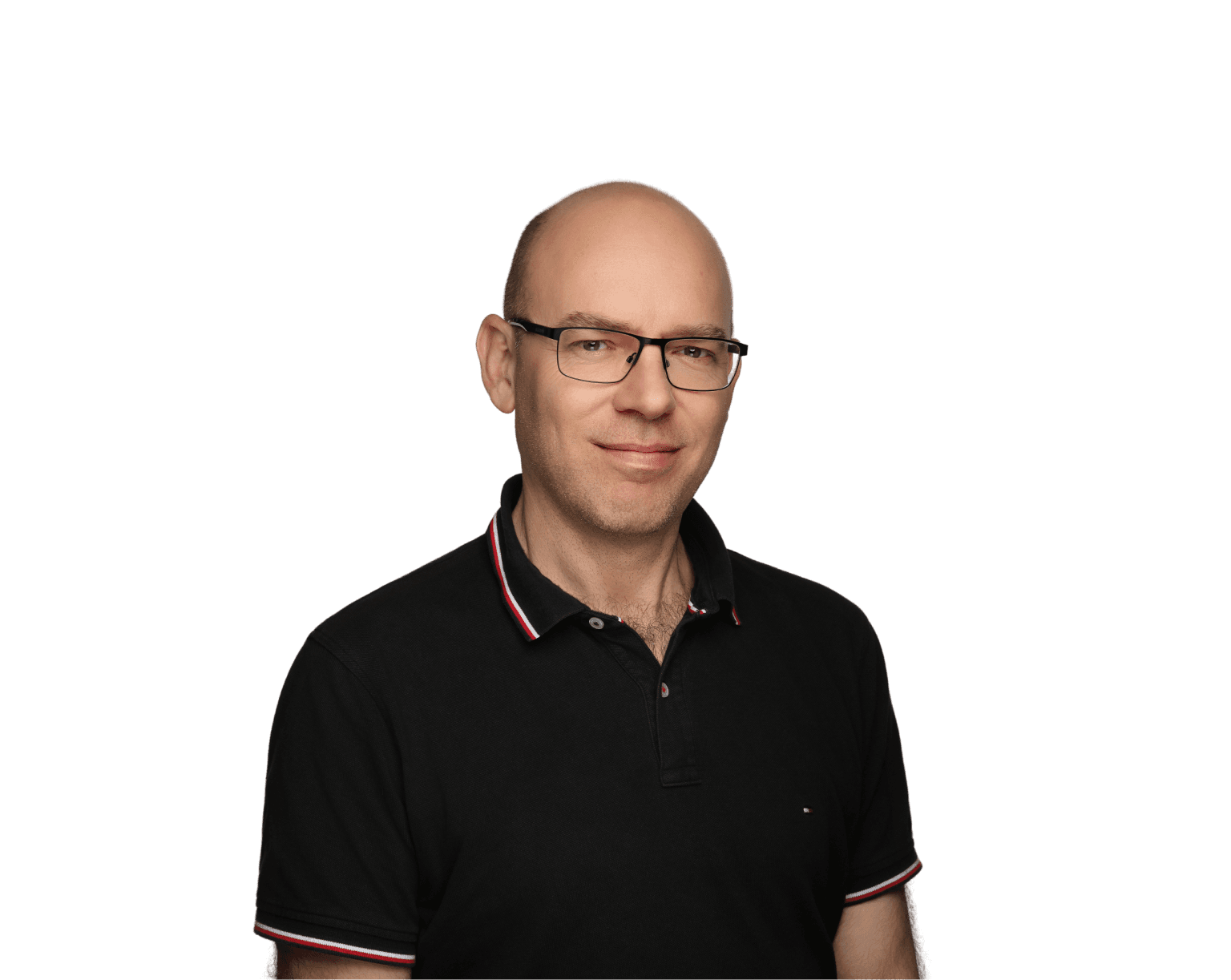 Paul Counihan, Chief of Staff, smiling in a black polo shirt against a blue background.