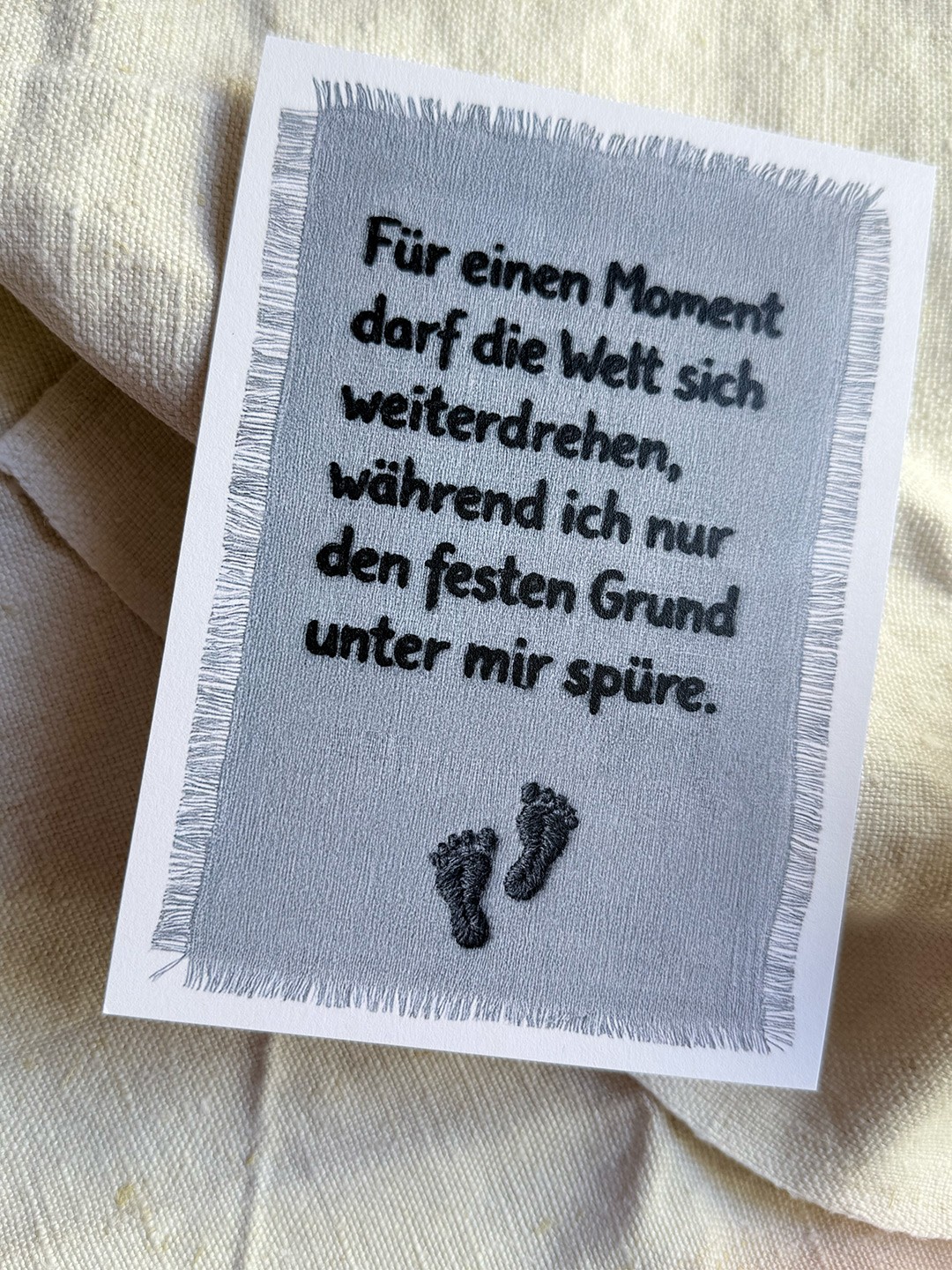 A Card with a embroidered Text