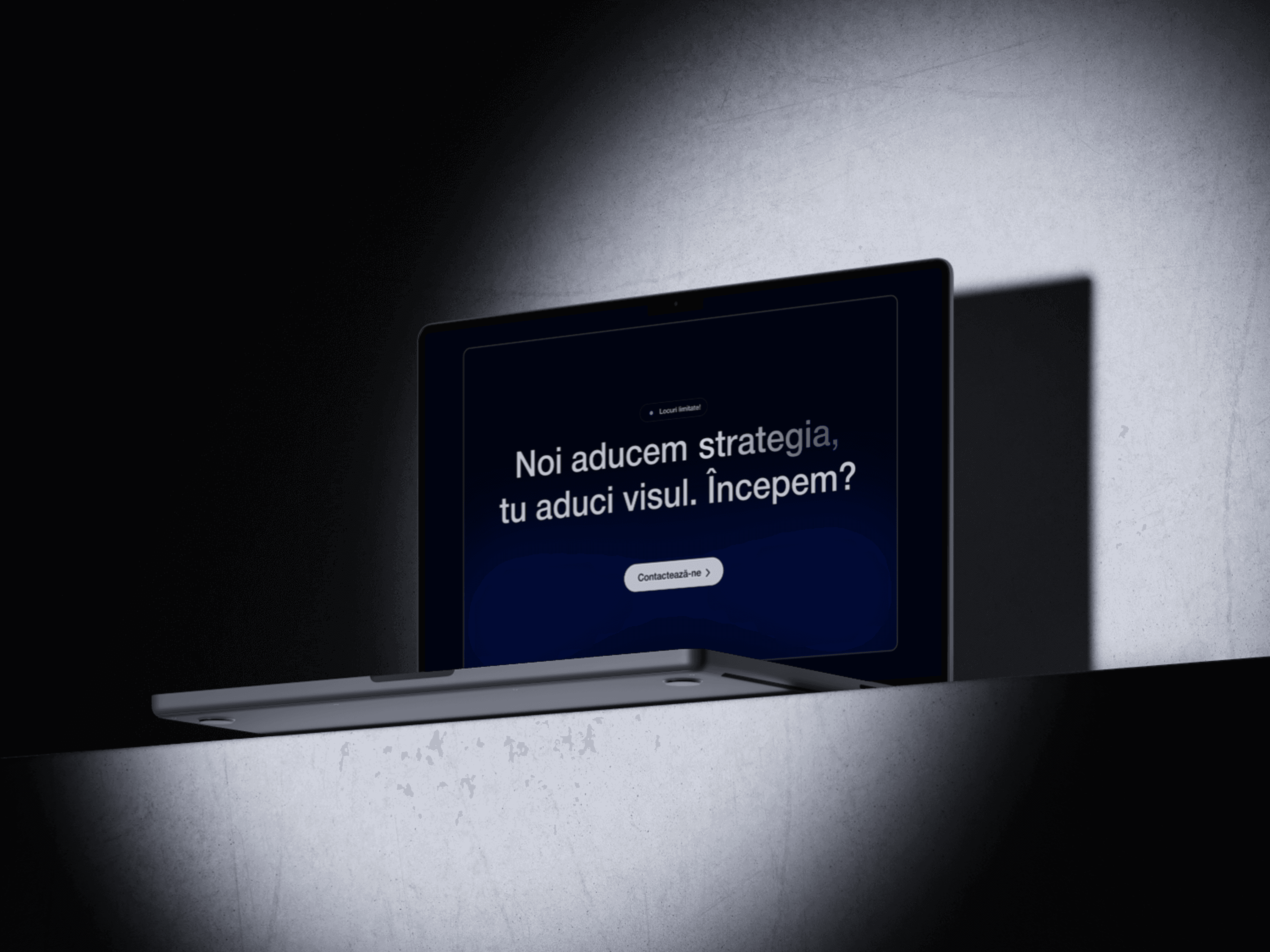 A laptop is displayed with a dark screen showing a message against a softly lit background.