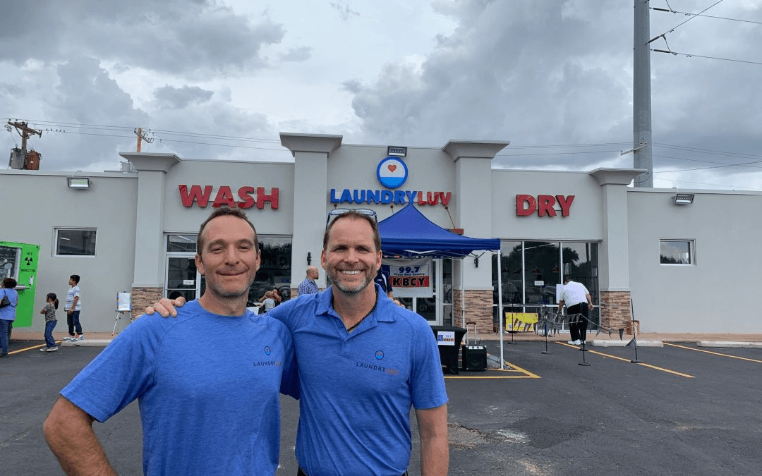 Only Epic Holdings CEO Jason Mittman and Laundry Luv Co-Founder and Chief Visionary Officer Ken Wimberly standing together in front of the Laundry Luv location at 3202 N. First Street in Abilene, Texas.