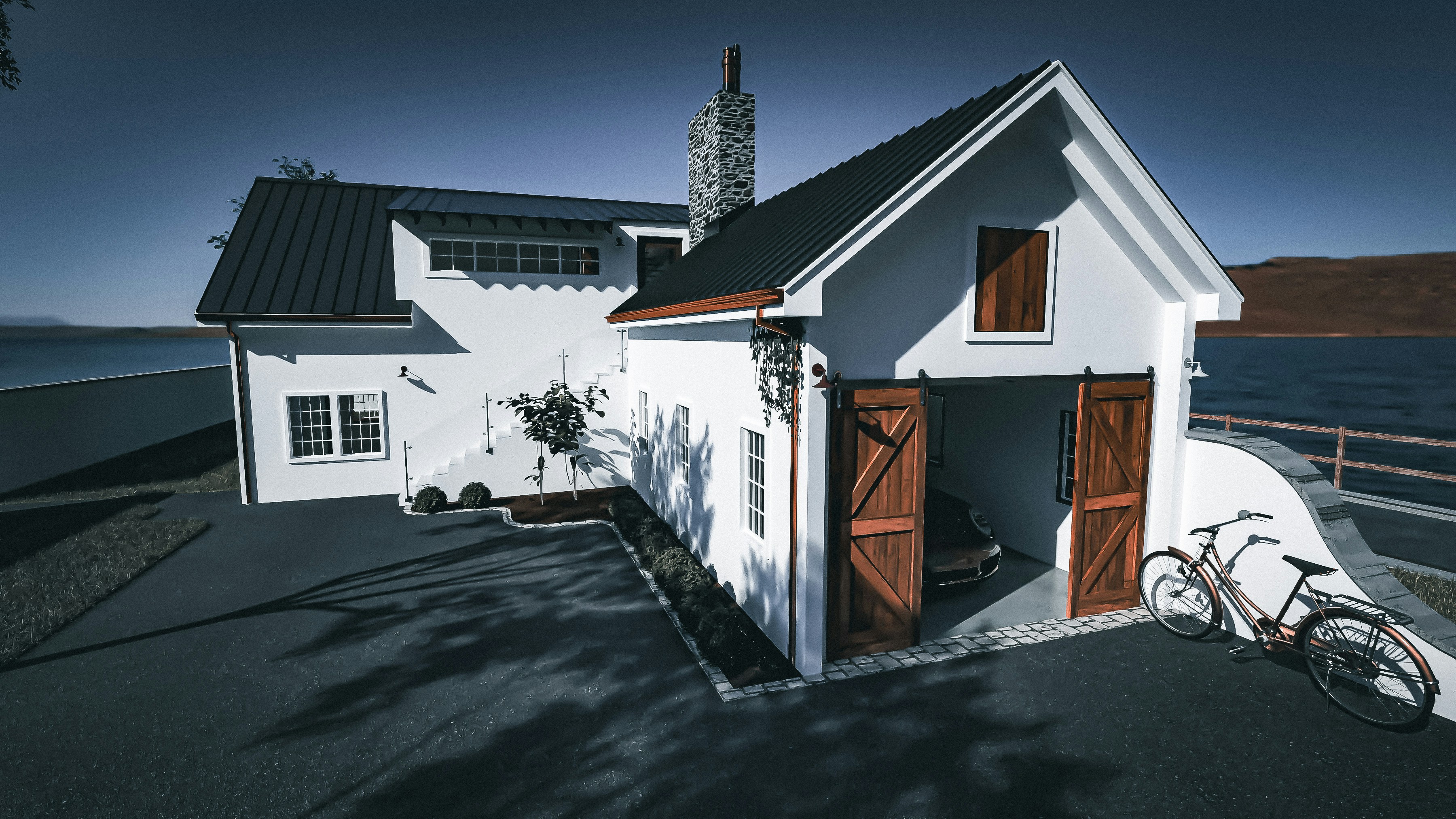 Exterior render of a white coastal house with wooden garage doors, a bicycle outside, dark roof details, and ocean views in the background.