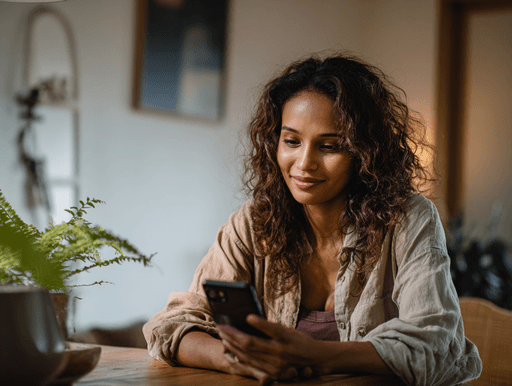 A maroon passport, a credit card, and a document are placed on a dark surface.