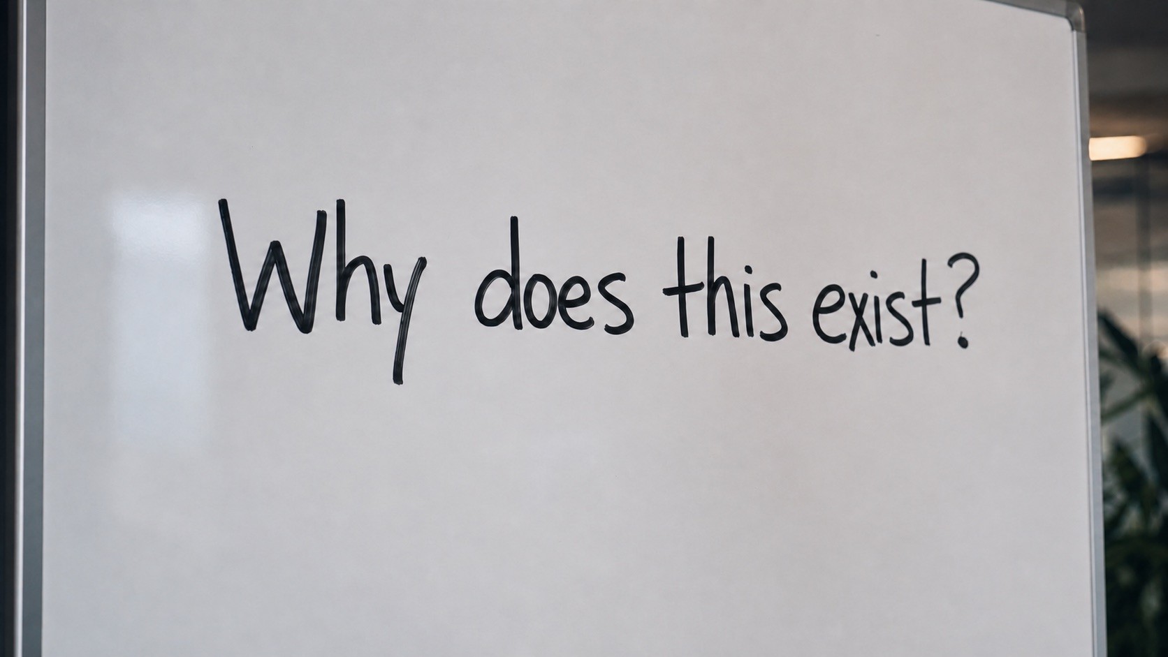 An empty GoMarble office whiteboard asking why a process exists