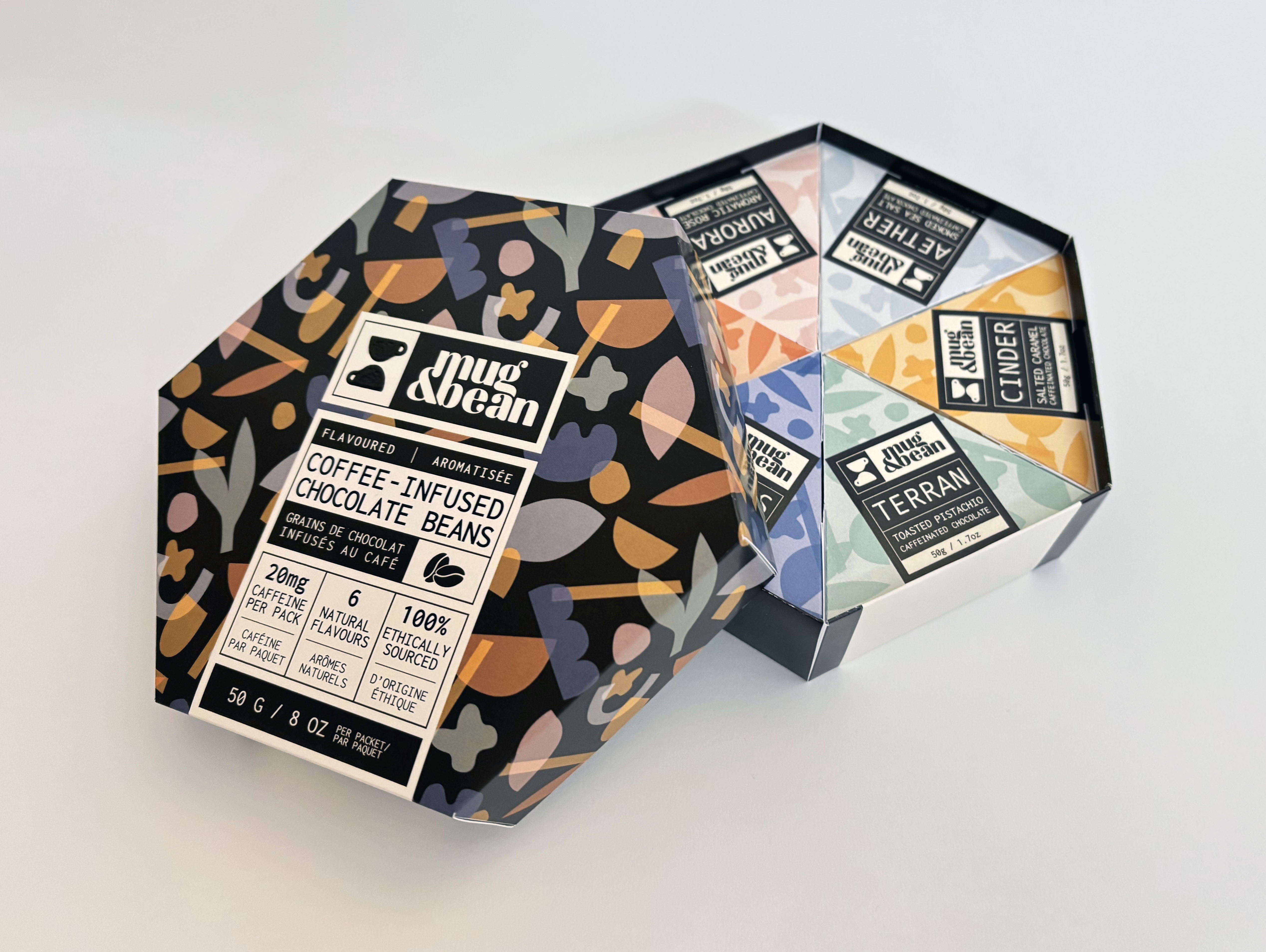 Modern home office setup with a monitor, ergonomic chair, keyboard, and indoor plants near a window with blinds.